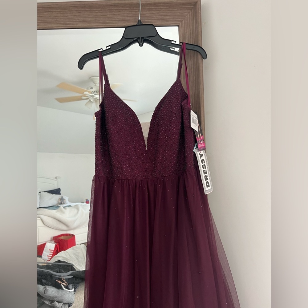 Maroon colored prom dress. NEVER WORN! Size 16